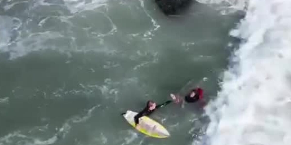 Fall Off Jetty Surfers rescue fisherman who got knocked off jetty into choppy waters