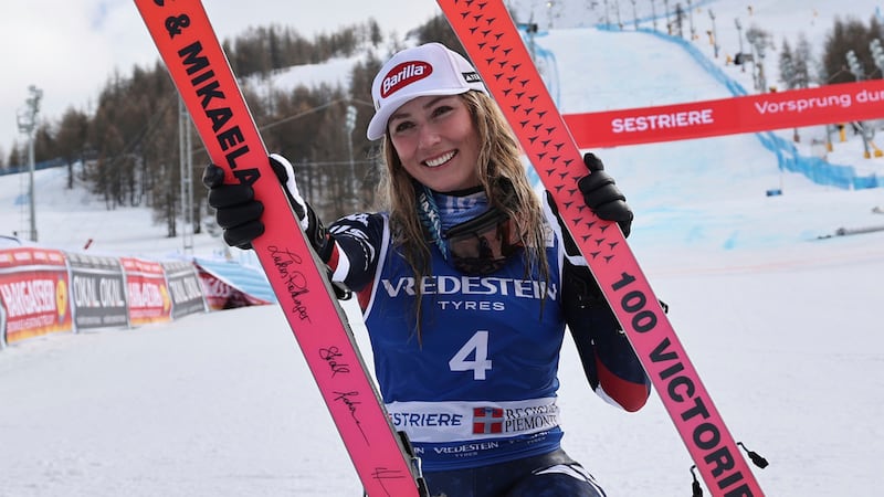 FILE - United States' Mikaela Shiffrin poses with her commemorative skis for her 100th victory...
