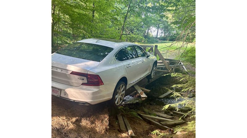 Police say a man nearly drove his car off a pedestrian bridge in Bradford on Wednesday.