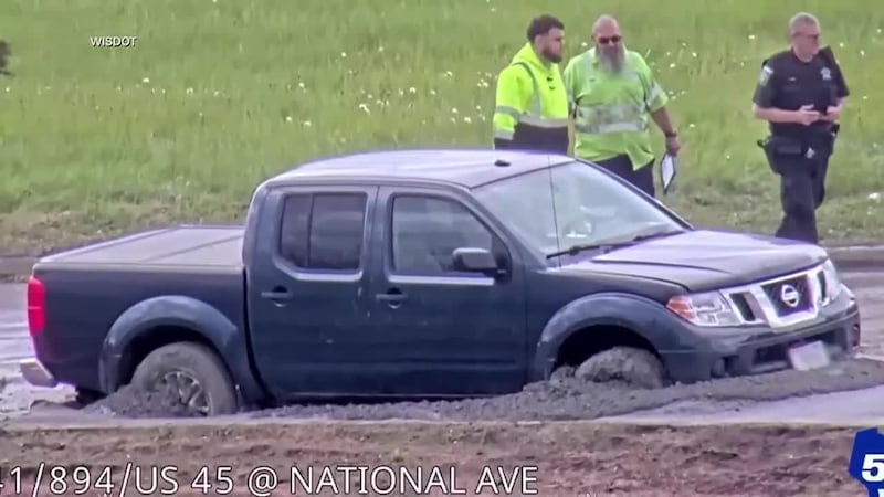 Officials say a driver ignored a “road closed” sign then found out why it was there the hard...